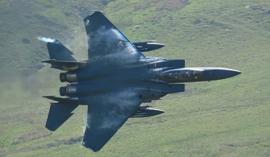 RAF fighter jet low-level flying through the Mach Loop valley in Mid & North West Wales, Wales
